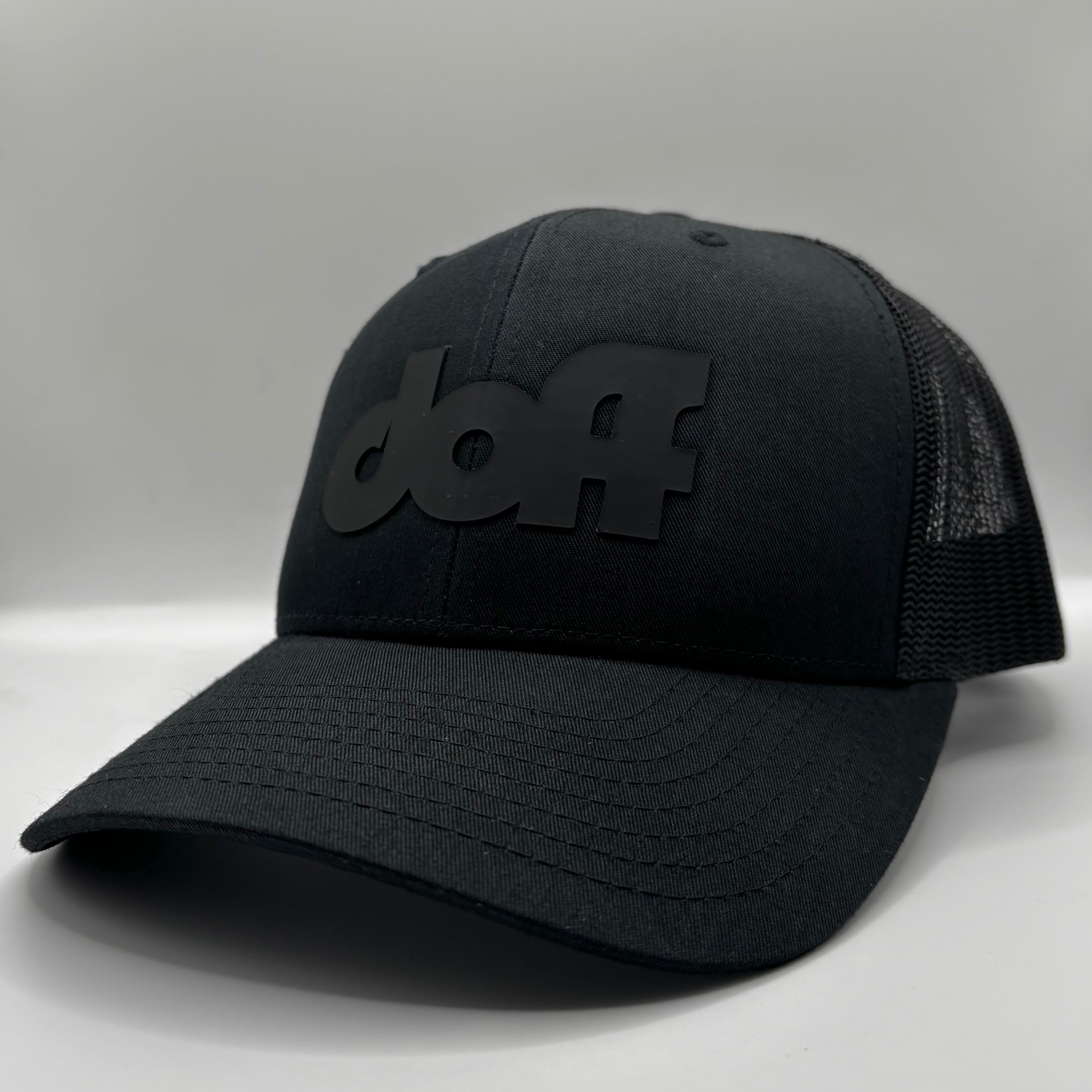BLACK ON BLACK TRUCKER